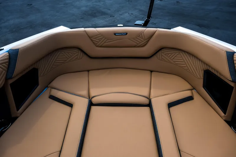 Slide: The Image of 2026 MasterCraft XStar 25 boat interior with tan leather seating and modern design. - 22