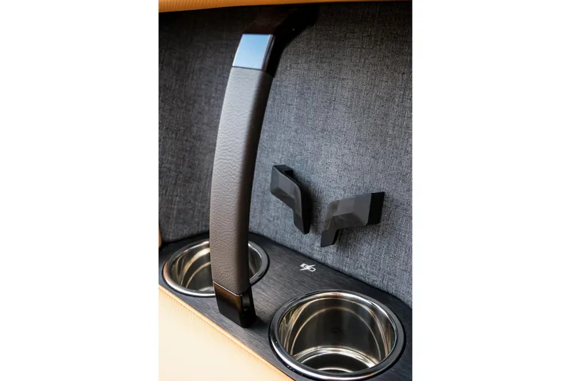 Slide: The Image of 2026 MasterCraft XStar 25 interior detail with cup holders and handle. - 23