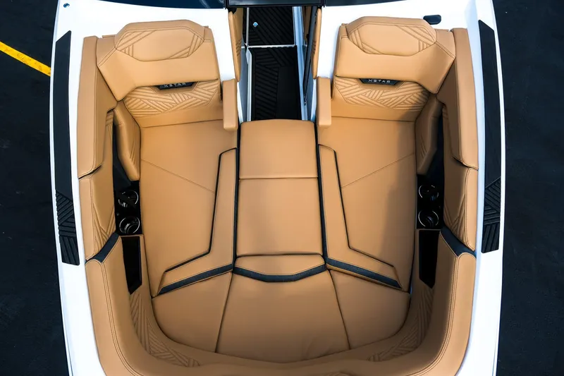 Slide: The Image of Luxurious tan seating in 2026 MasterCraft XStar 25 boat interior. - 26
