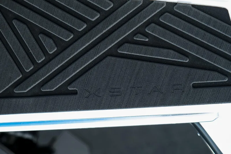 Slide: The Image of 2026 MasterCraft XStar 25 boat deck with embossed design and logo. - 28