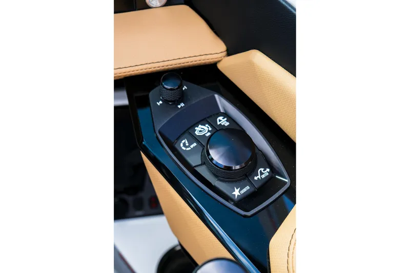 Slide: The Image of Control panel of 2026 MasterCraft XStar 25 boat with sleek design and intuitive buttons. - 30