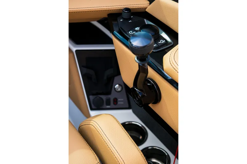 Slide: The Image of Interior controls of 2026 MasterCraft XStar 25 boat, featuring tan upholstery and sleek design. - 31