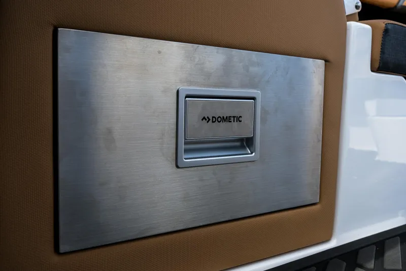 Slide: The Image of Stainless steel Dometic panel on 2026 MasterCraft XStar 25 boat interior. - 33