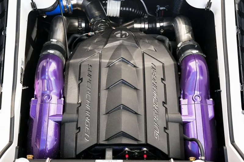 Slide: The Image of Engine of 2026 MasterCraft XStar 25 with purple components and supercharger. - 39