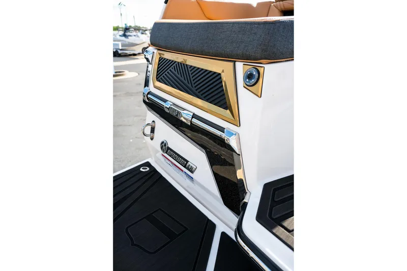 Slide: The Image of 2026 MasterCraft XStar 25 boat rear view with sleek design and premium finishes. - 45