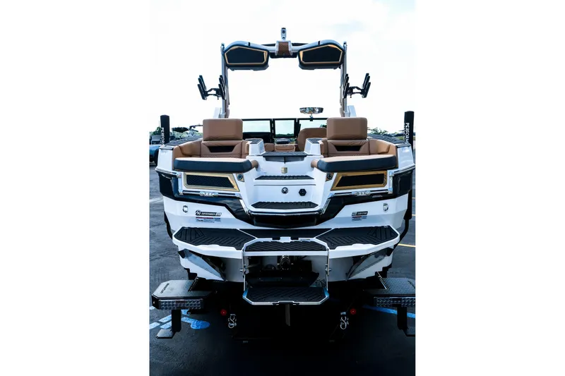 Slide: The Image of 2026 MasterCraft XStar 25 boat, rear view, showcasing sleek design and luxurious seating. - 8