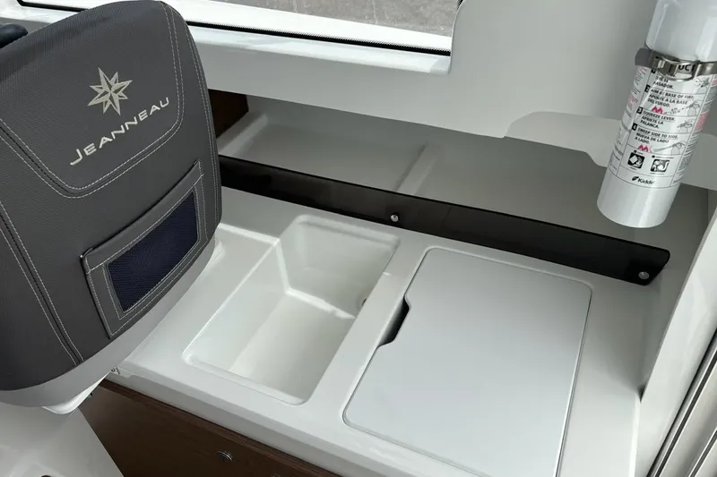 Slide: The Image of Interior of 2023 Jeanneau NC Weekender 695 Series 2, featuring seating and storage. - 18