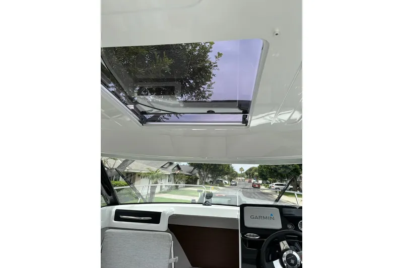 Slide: The Image of 2023 Jeanneau NC Weekender 695 Series 2 interior with sunroof and Garmin navigation. - 19