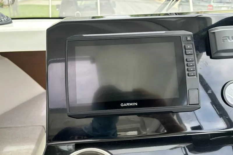 Slide: The Image of Garmin navigation system on 2023 Jeanneau NC Weekender 695 Series 2 boat dashboard. - 23
