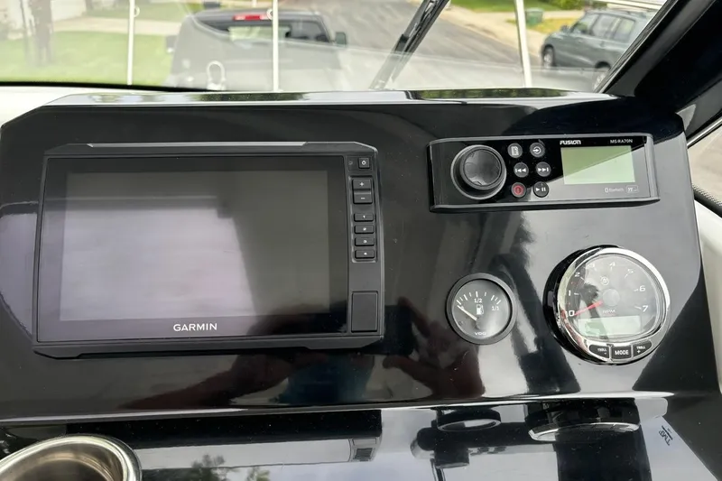 Slide: The Image of Dashboard of 2023 Jeanneau NC Weekender 695 Series 2 with Garmin and Fusion electronics. - 24