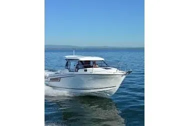 Slide: The Image of 2023 Jeanneau NC Weekender 695 Series 2 cruising on open water. - 3