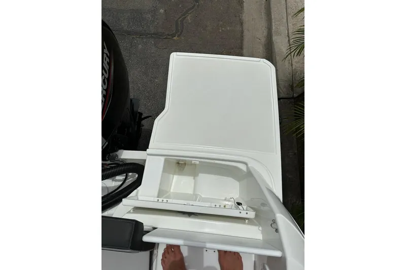 Slide: The Image of 2023 Jeanneau NC Weekender 695 Series 2 boat deck with storage compartment. - 7