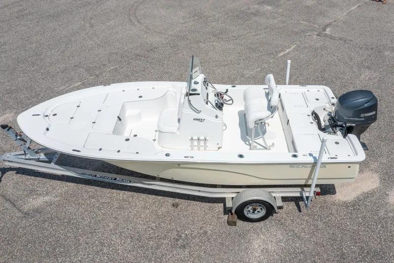 Slide: The Image of 2013 Sea Fox 200XT boat on trailer, featuring Yamaha outboard motor. - 1