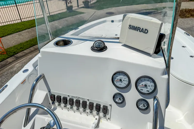Slide: The Image of 2013 Sea Fox 200XT boat dashboard with Simrad navigation and gauges. - 15