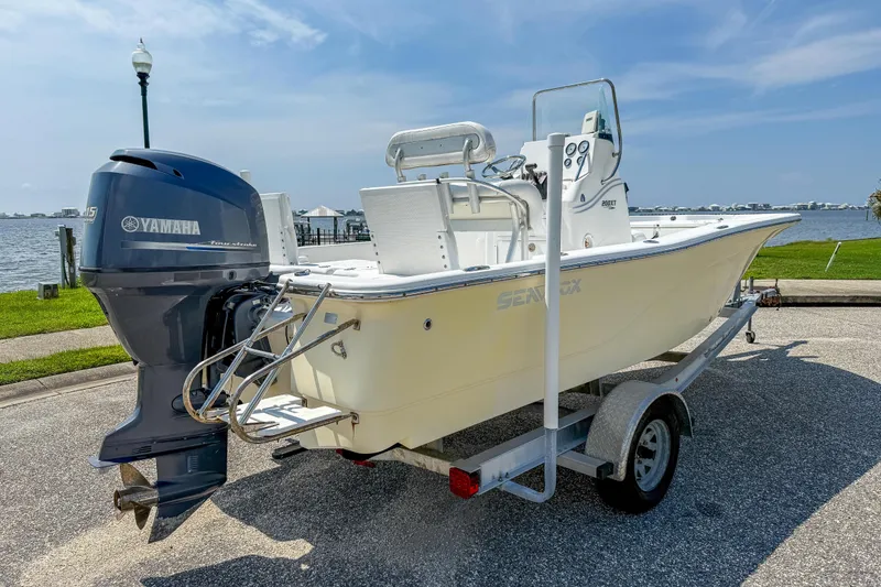 Slide: The Image of 2013 Sea Fox 200XT boat with Yamaha engine on trailer by waterfront. - 5