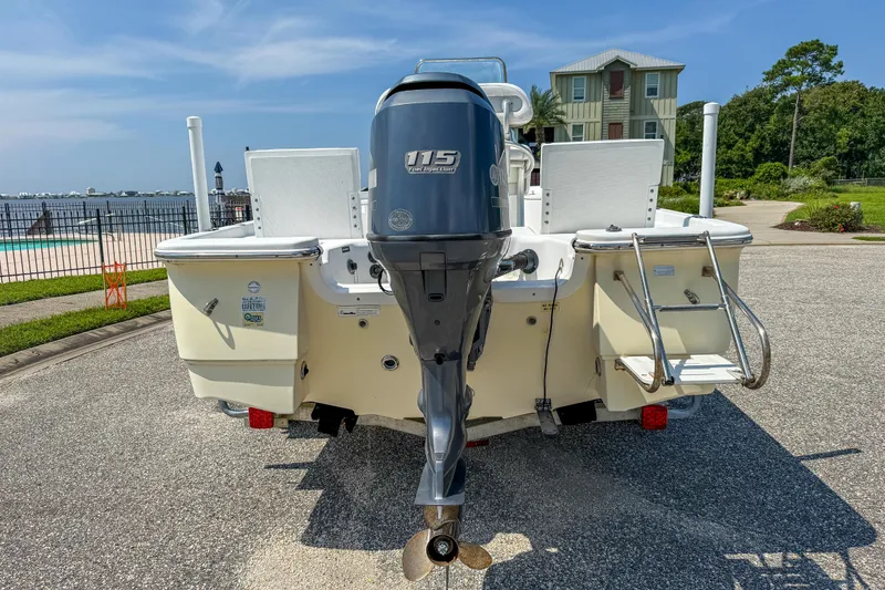 Slide: The Image of 2013 Sea Fox 200XT boat with Yamaha 115 outboard motor, parked near waterfront. - 9