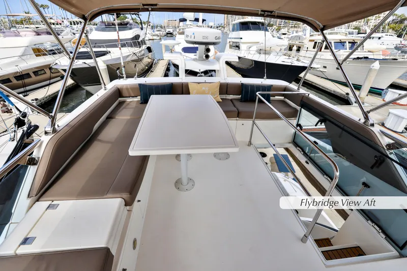 Slide: The Image of Upper helm of 2013 Fairline Squadron 42 yacht in marina setting. - 10