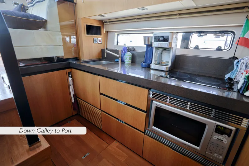 Slide: The Image of Interior storage space on 2013 Fairline Squadron 42 yacht with wooden finish. - 19