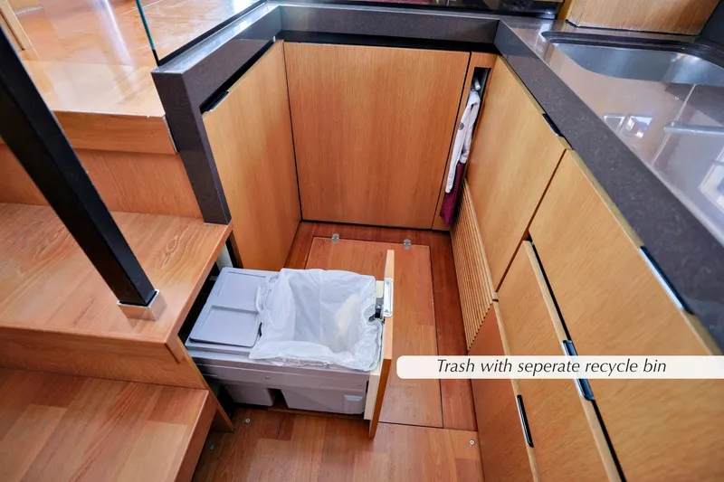 Slide: The Image of Compact kitchen storage in 2013 Fairline Squadron 42 yacht, showcasing efficient space utilization. - 22