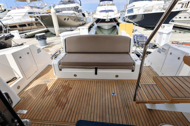 Slide: The Image of 2013 Fairline Squadron 42 yacht with staircase to bridge, docked at marina. - 8