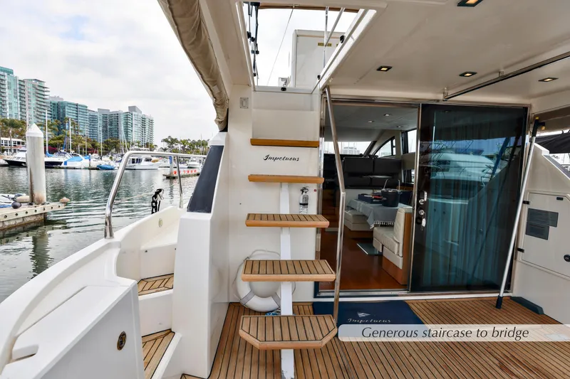 Slide: The Image of Flybridge of 2013 Fairline Squadron 42 yacht, featuring spacious seating and table. - 9