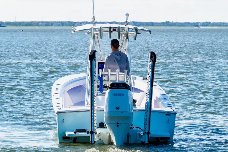 Slide: The Image of 1979 SeaCraft SF23 boat with outboard motor on calm water. - 5