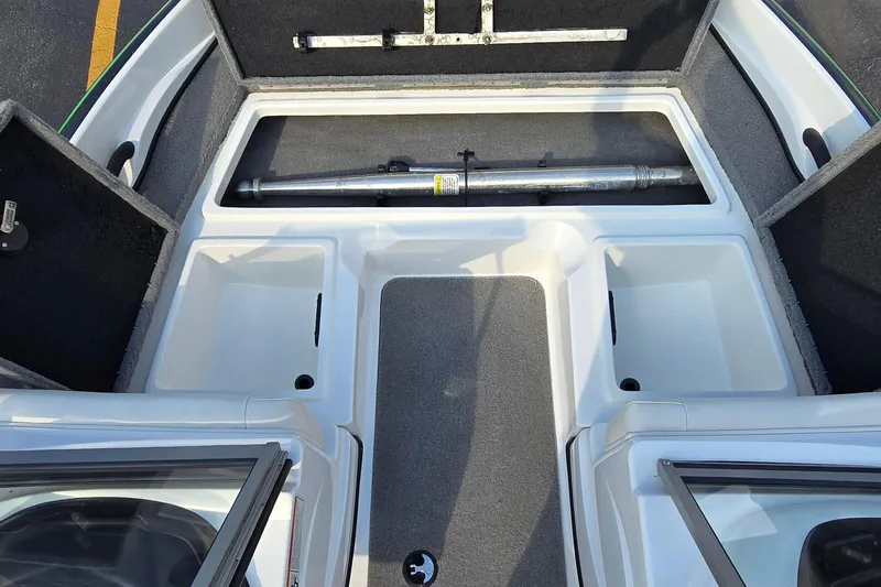Slide: The Image of 2020 Nitro Z19 Sport boat interior storage compartments and rod holder. - 12