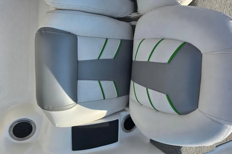 Slide: The Image of 2020 Nitro Z19 Sport boat seats with gray and green accents. - 15