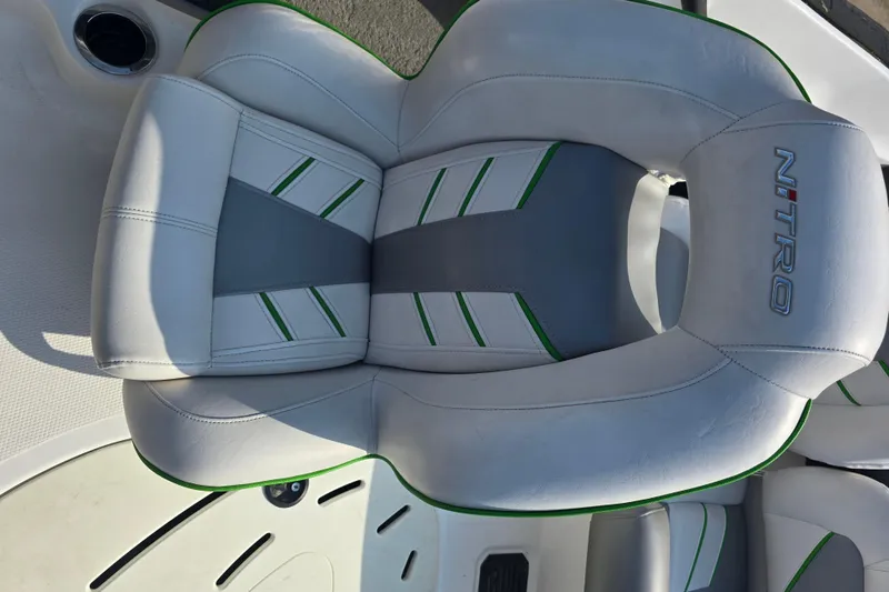 Slide: The Image of 2020 Nitro Z19 Sport boat seat with gray and green accents. - 16