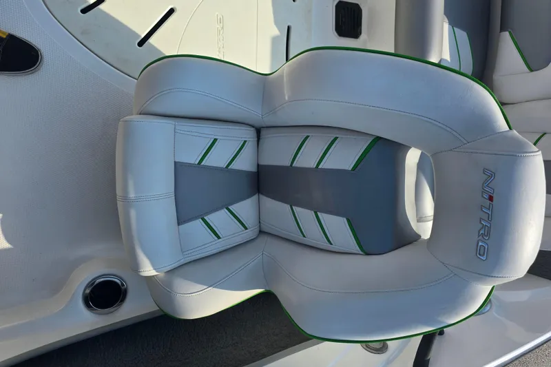Slide: The Image of 2020 Nitro Z19 Sport boat seat with green accents and logo. - 17