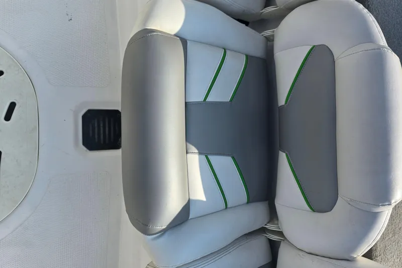 Slide: The Image of 2020 Nitro Z19 Sport boat seat with gray and green accents. - 18