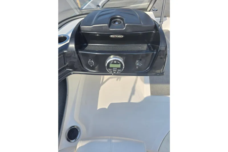 Slide: The Image of Dashboard of 2020 Nitro Z19 Sport boat with control panel and cup holder. - 6