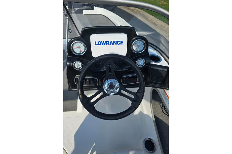Slide: The Image of Steering console of 2020 Nitro Z19 Sport boat with Lowrance display and gauges. - 7