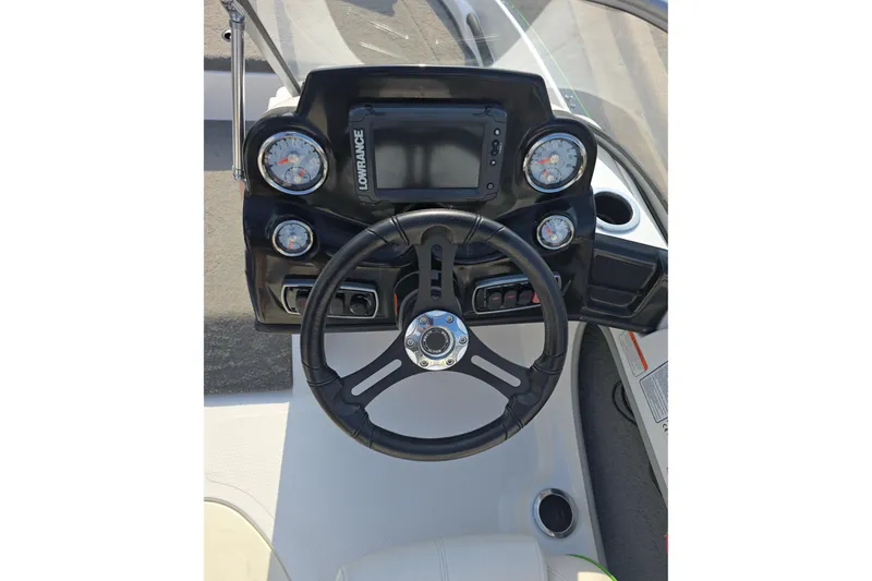 Slide: The Image of Steering console of 2020 Nitro Z19 Sport boat with gauges and Lowrance display. - 8