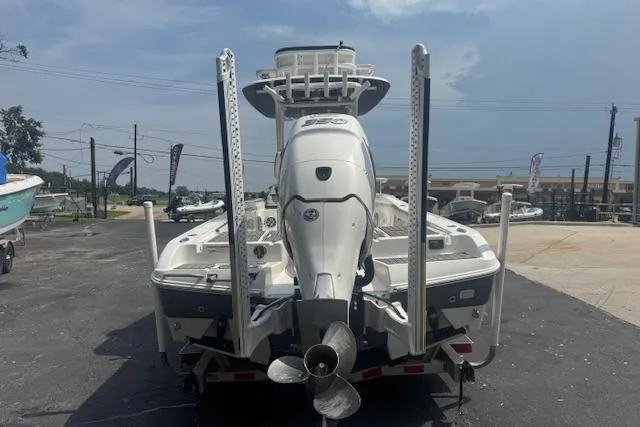 Slide: The Image of 2018 Crevalle 26 HBW boat, rear view, parked on a trailer in a lot. - 2