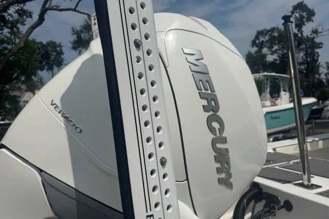 Slide: The Image of 2018 Crevalle 26 HBW boat with Mercury Verado engine, docked outdoors. - 4