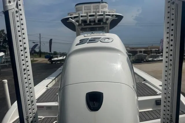 Slide: The Image of 2018 Crevalle 26 HBW boat with powerful 350 engine, docked outdoors. - 5