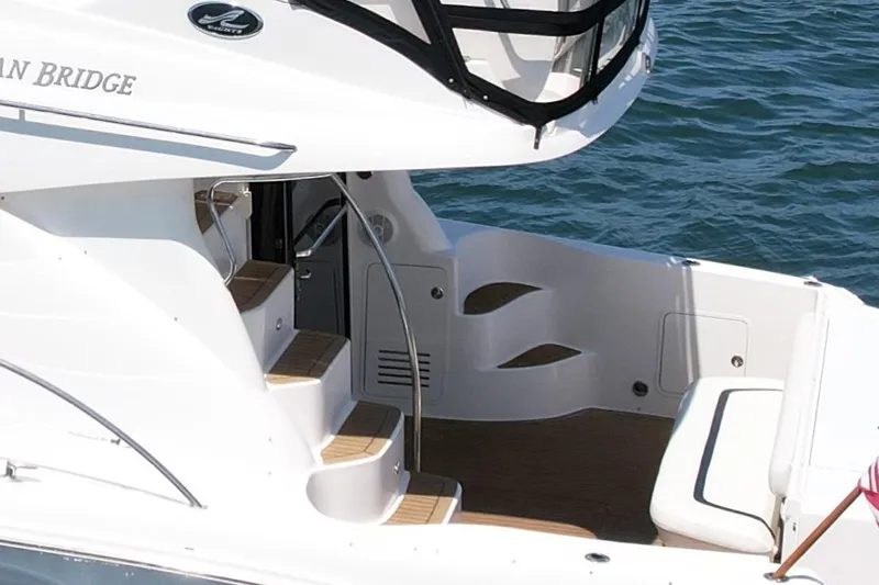 Slide: The Image of 2007 Sea Ray 52 Sedan Bridge yacht with elegant deck and seating area. - 11