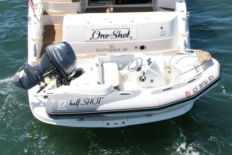 Slide: The Image of 2007 Sea Ray 52 Sedan Bridge with Zodiac tender and Yamaha motor on water. - 13