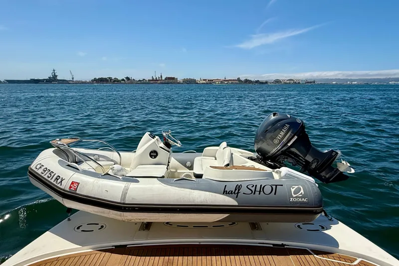 Slide: The Image of 2007 Sea Ray 52 Sedan Bridge with Zodiac tender and Yamaha motor on open water. - 18