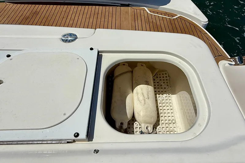 Slide: The Image of Storage compartment on 2007 Sea Ray 52 Sedan Bridge yacht with fenders inside. - 21