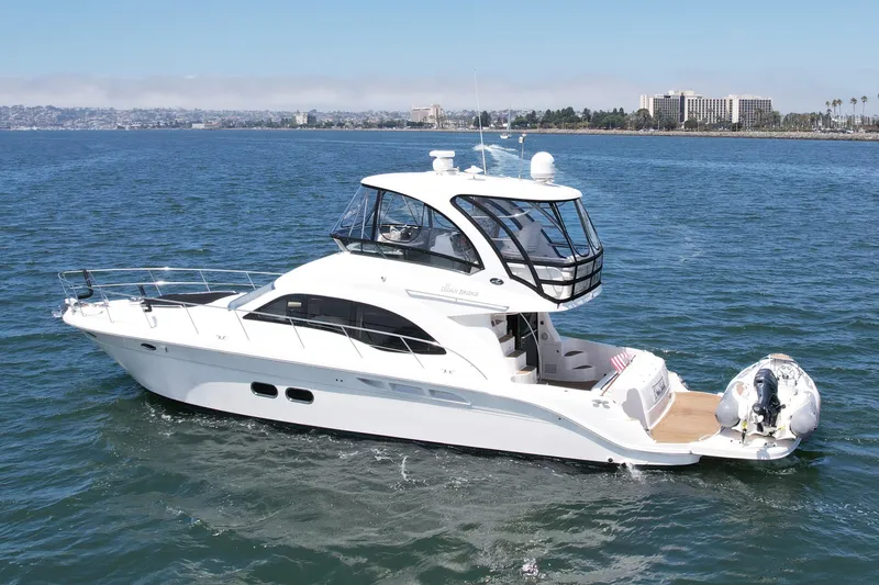 Slide: The Image of 2007 Sea Ray 52 Sedan Bridge yacht cruising on open water. - 3