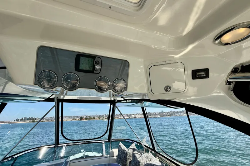 Slide: The Image of Interior view of 2007 Sea Ray 52 Sedan Bridge yacht with dashboard and ocean backdrop. - 32