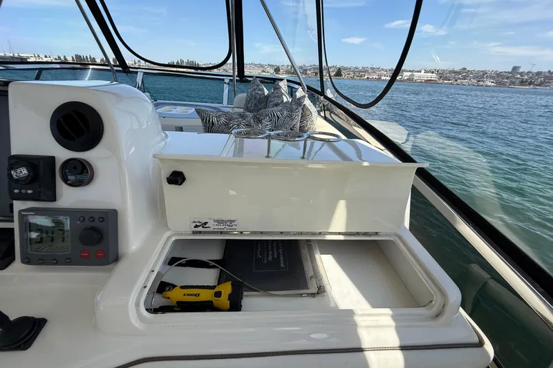 Slide: The Image of 2007 Sea Ray 52 Sedan Bridge helm with navigation equipment and ocean view. - 36