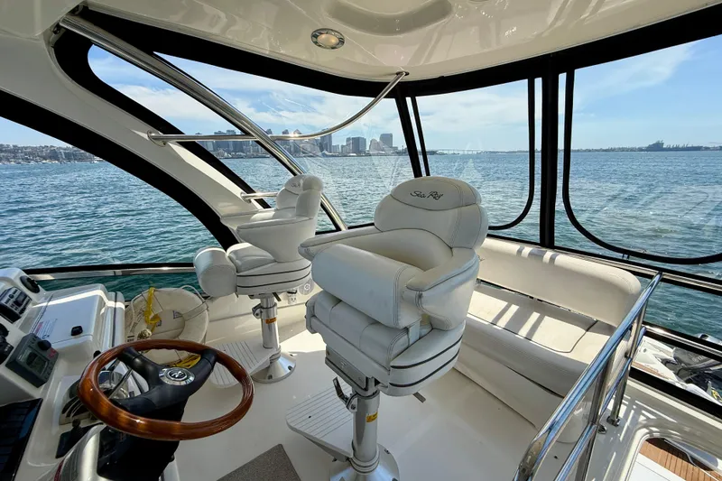 Slide: The Image of Interior view of 2007 Sea Ray 52 Sedan Bridge yacht with luxurious seating and ocean backdrop. - 41