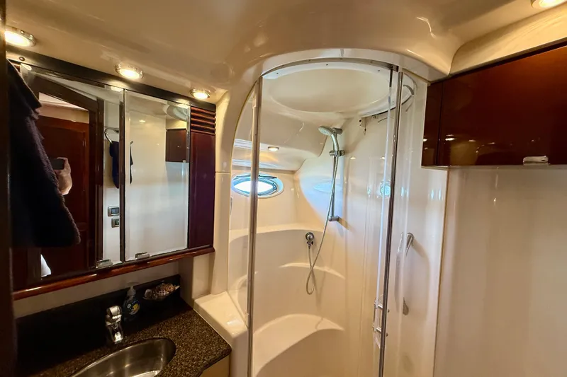 Slide: The Image of Luxurious bathroom in 2007 Sea Ray 52 Sedan Bridge yacht with modern shower and vanity. - 45