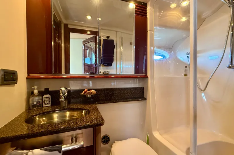 Slide: The Image of Luxurious bathroom in 2007 Sea Ray 52 Sedan Bridge yacht with modern fixtures. - 53