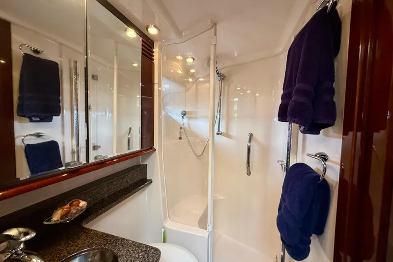 Slide: The Image of Luxurious bathroom in 2007 Sea Ray 52 Sedan Bridge yacht with shower and elegant fixtures. - 58