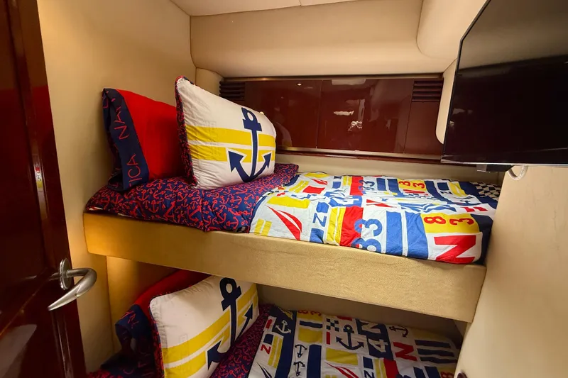 Slide: The Image of Bunk beds with nautical-themed bedding in 2007 Sea Ray 52 Sedan Bridge yacht cabin. - 60