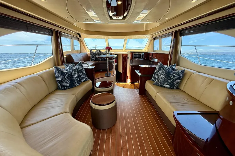 Slide: The Image of Luxurious interior of 2007 Sea Ray 52 Sedan Bridge yacht with elegant seating and ocean view. - 63
